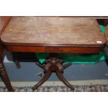 A mahogany tea table, 19th century, the fold over top above a turned stem and downswept supports,