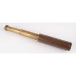A Britannic 15x three draw brass telescope, brown leather covered, closed length 16.7cm.