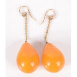 A pair of amber earrings. Condition report: Length of earrings - 5.