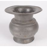 A Chinese pewter spittoon, 19th century, of squat form with a flared rim, signed to base,