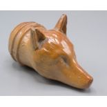 A saltglaze stoneware spirit flask, in the form of a foxes head, length 12cm.