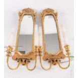 A pair of gilt composition girondelles, 18th century style, height 55cm, width 18.5cm.