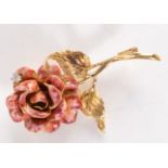 An 18ct gold Italian brooch in the form of a rose its petals pink enamelled,