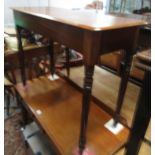 A Victorian mahogany side table, the rectangular moulded top on turned tapering supports,