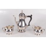 A post war Mappin & Webb three piece silver coffee service comprising a coffee pot with acorn