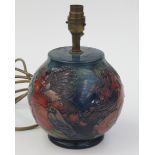 A Moorcroft pottery 'Finch and Fruit' pattern table lamp, painted initials PM to base,