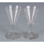 A pair of conical wine glasses, 19th century, height 12cm.