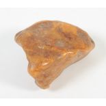 A water washed natural amber specimen, 87g, maximum length 81mm.