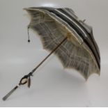 A silver handled lady's silk parasol, handle length 11cm, total length 92.5cm.