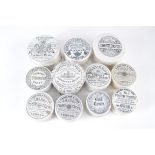 Eleven toothpaste pots, including Cherry Toothpaste, Anchovy Paste and oriental.