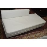 A 1960s white vinyl studio couch,approximate height 98cm, length 187cm, depth 75cm.