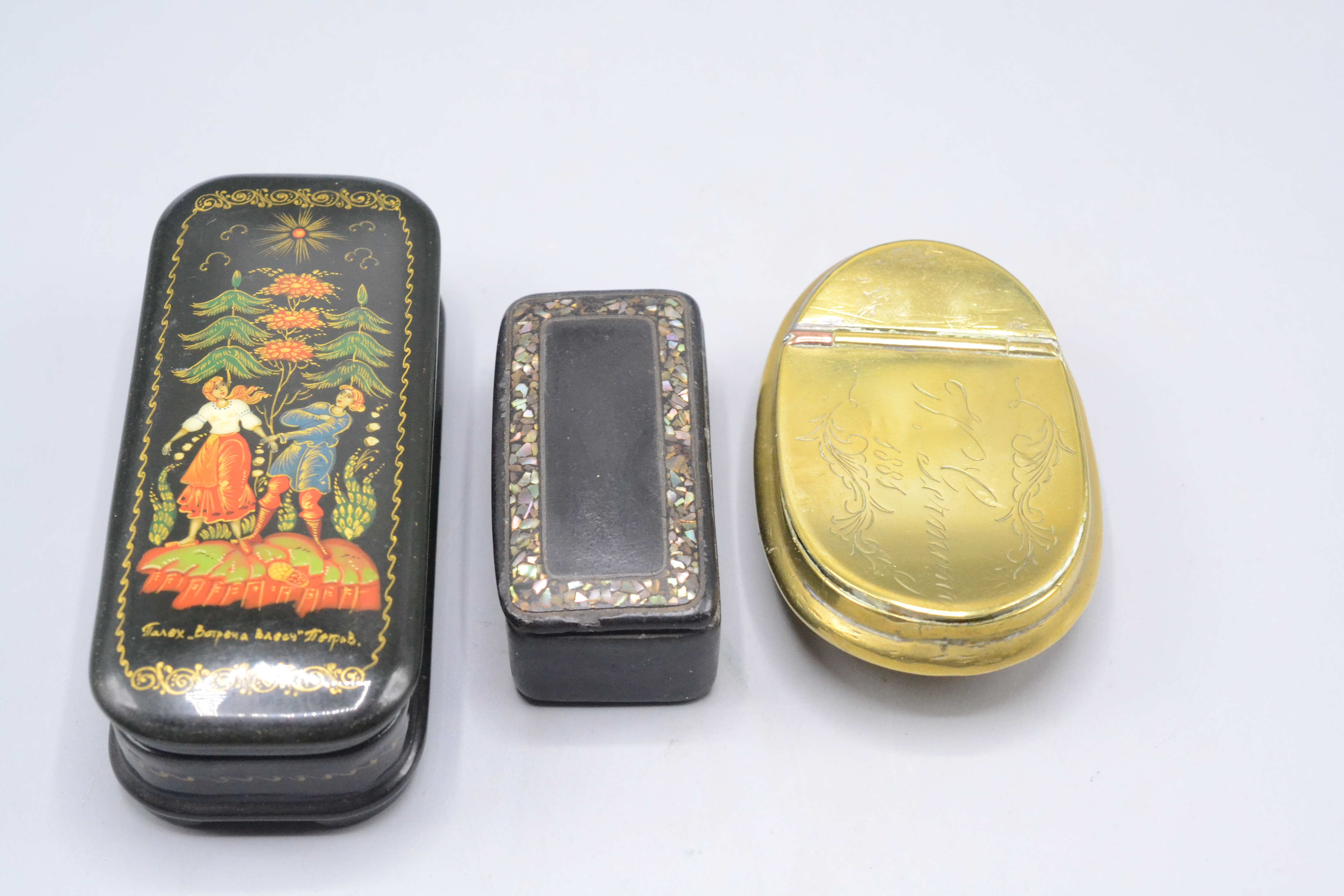 A brass snuff box, 19th century, the hinged cover indistinctly signed, dated 1881, 8 x 5.