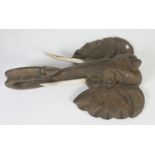 A large carved wood model of an elephants head, length 100cm, width 68cm.