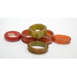 Six early plastic napkin rings.