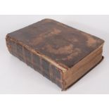 A leather bound bible, containing the old and new testaments,