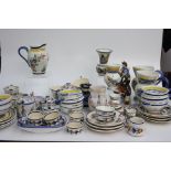 A large collection of Quimper French pottery, including jugs, plates, bowls and figures etc.