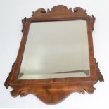A mahogany and burr walnut framed wall mirror, 19th century, 41.5 x 28cm.