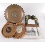 A brass tray, diameter 37cm, two oval framed prints in gilt frames,