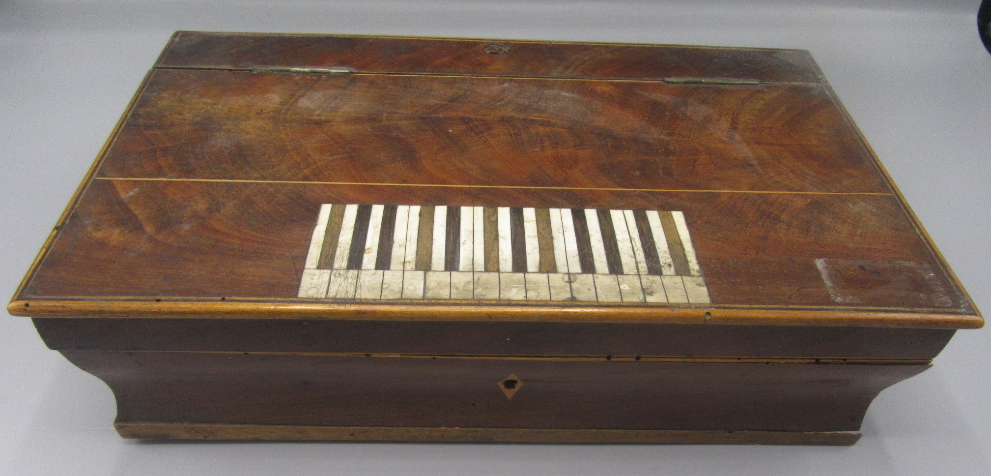 A Palais Royale inlaid mahogany musical sewing box, 19th century, in the form of a square piano,