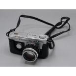 An Olympus-Pen F camera, with Olympus G.Zuiko Auto-S 1:1.4 f=40mm 185078 lens.