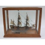 A model of the Mayflower in a mahogany glazed display case,