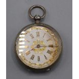 A silver key wind fob watch with ornate coloured gold open face.