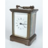 A brass carriage clock, of small proportions, the white enamelled dial with roman numerals,