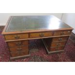 An Aesthetic Movement oak partners pedestal desk, late 19th century,