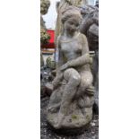 A composition garden statue of a seated young woman, height 61cm and a statue of a classical maiden,