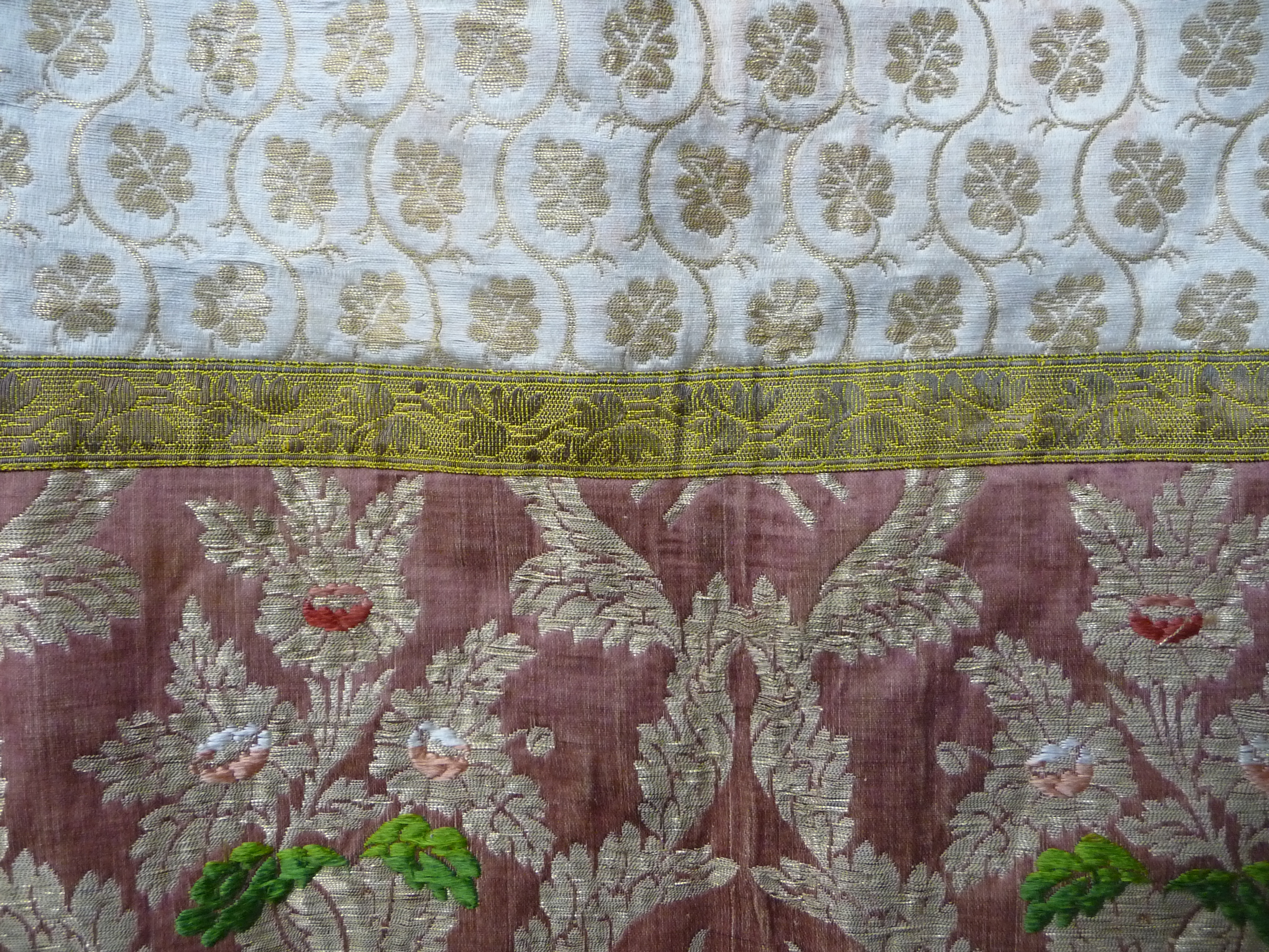 An eastern silk and metal thread over tunic, decorated with floral sprays and leaves, length 101cm. - Image 3 of 8