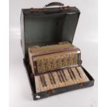 A German Pietro piano accordian, in original case, width 34.5cm.
