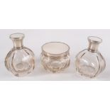 A pair of pre war Italian silver, ivory and cut glass scent bottles and a matching powder jar,