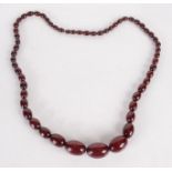 A cherry 'amber' necklace.