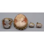 A gold mounted cameo brooch, a similar ring and a pair of similar earrings.