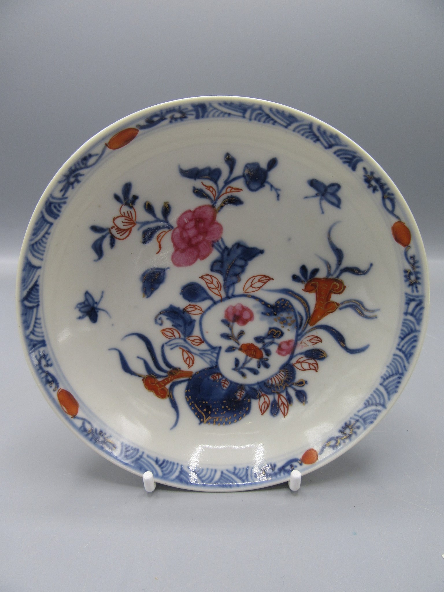 A Chinese porcelain saucer dish, 18th century,decorated with floral sprays,