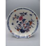 A Chinese porcelain saucer dish, 18th century,decorated with floral sprays,
