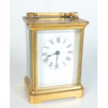 A brass carriage clock, the white enamelled dial with roman numerals, the movement initialled A.C.C.