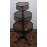 A George III style mahogany dumb waiter, with three circular tiers,