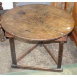 An oak occasional table, the 18th century circular top on a later pine base, height 58cm,