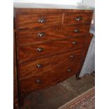 A mahogany chest of drawers, 19th century, with two short and four long graduated drawers,