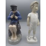 A Royal Copenhagen porcelain figure of a seated boy whittling a stick, height 18cm,