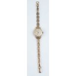A ladies Hamilton wristwatch on 9ct gold bracelet. Condition report: Weight 12.2g.