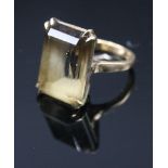 An 18ct gold dress ring set a topaz. Condition report: Hallmarked 18k. Size K.