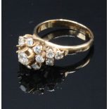 An 18ct gold eastern ring set with diamonds. Condition report: Weight 4.5g.