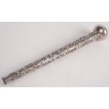 A Chinese silver parasol handle decorated with four-clawed dragons chasing flaming pearls. 21.3cm.