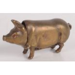 A brass pig vesta case.