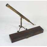 A late Victorian or Edwardian brass 6cm telescope with brass folding table tripod in fitted