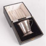 A silver post-war christening mug, 1.7oz, cased.