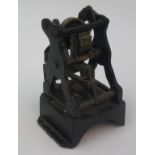 A cast iron and brass railway ticket dating press, height 21cm, width 15cm, depth 14cm.