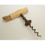 A Georgian Henshall type button corkscrew, with a turned ivory handle and brush, length 16cm,